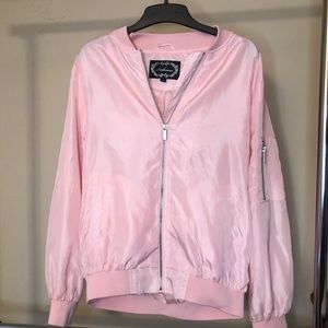 This is a pink bomber jacket.